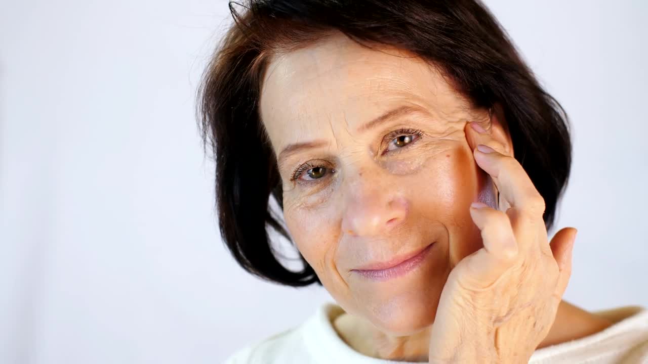 Stock Video Old Woman Touching The Skin Of Her Face Live Wallpaper