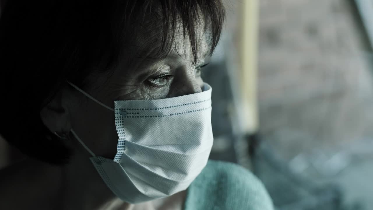 Stock Video Old Woman With Sad Look Wearing Mask Live Wallpaper