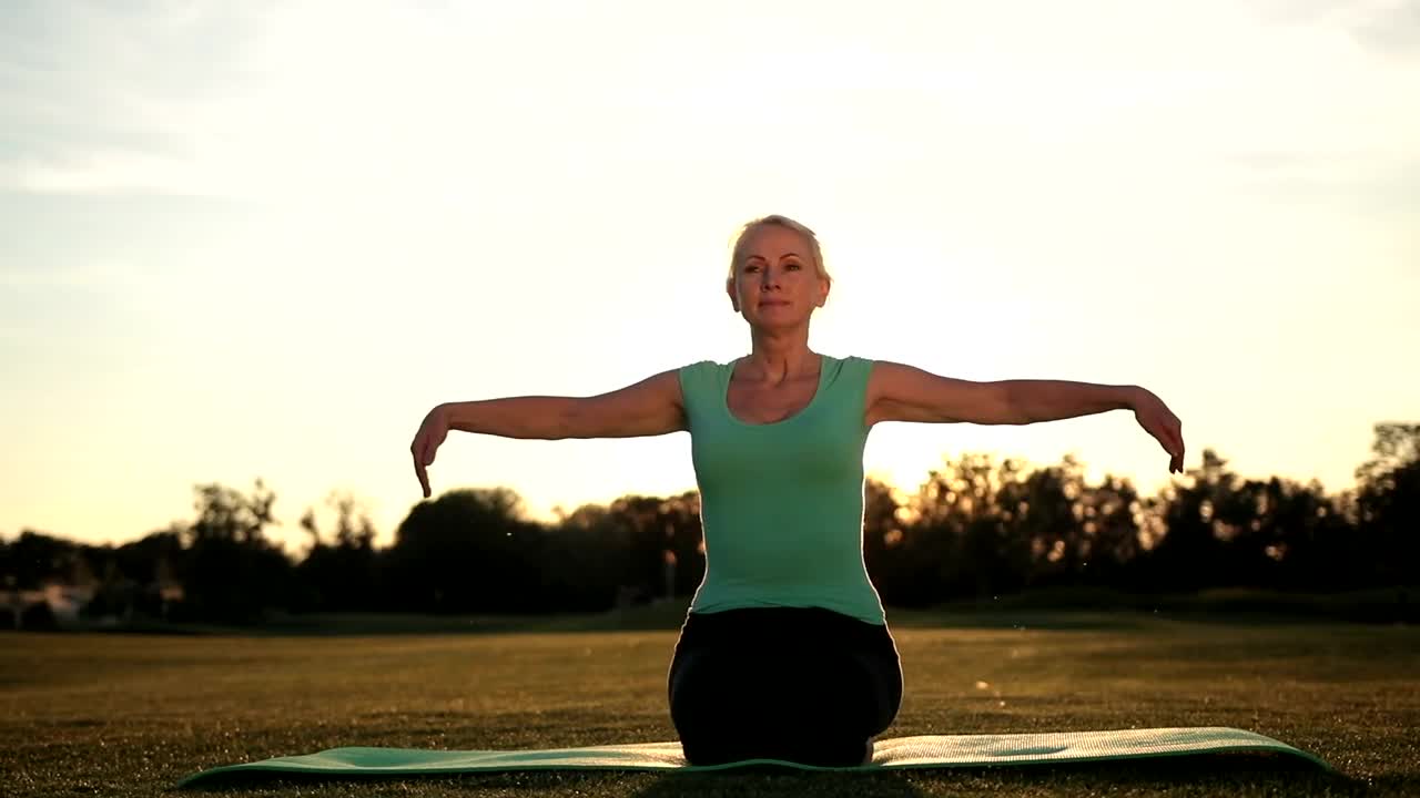 Stock Video Older Woman Doing Yoga Live Wallpaper