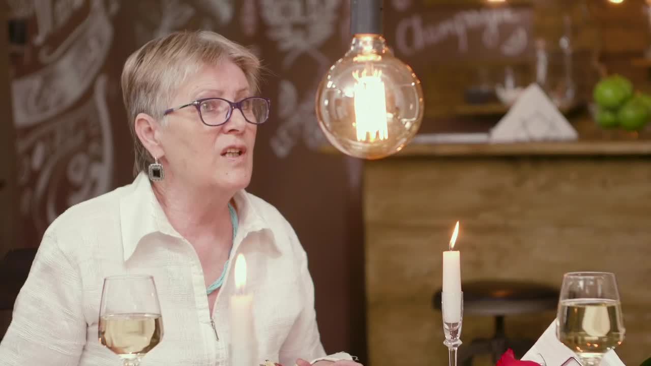 Stock Video Older Woman Has Difficult Romance On Dinner Date Live Wallpaper