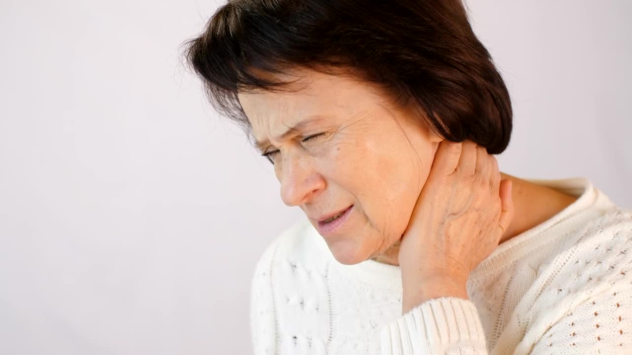 Stock Video Older Woman With Neck Tension Live Wallpaper