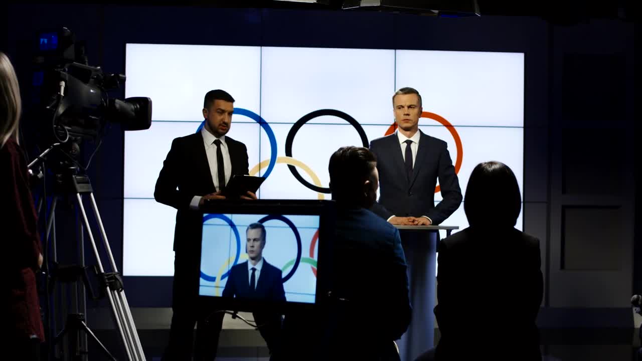 Stock Video Olympics Spokesman On A Television Interview Live Wallpaper