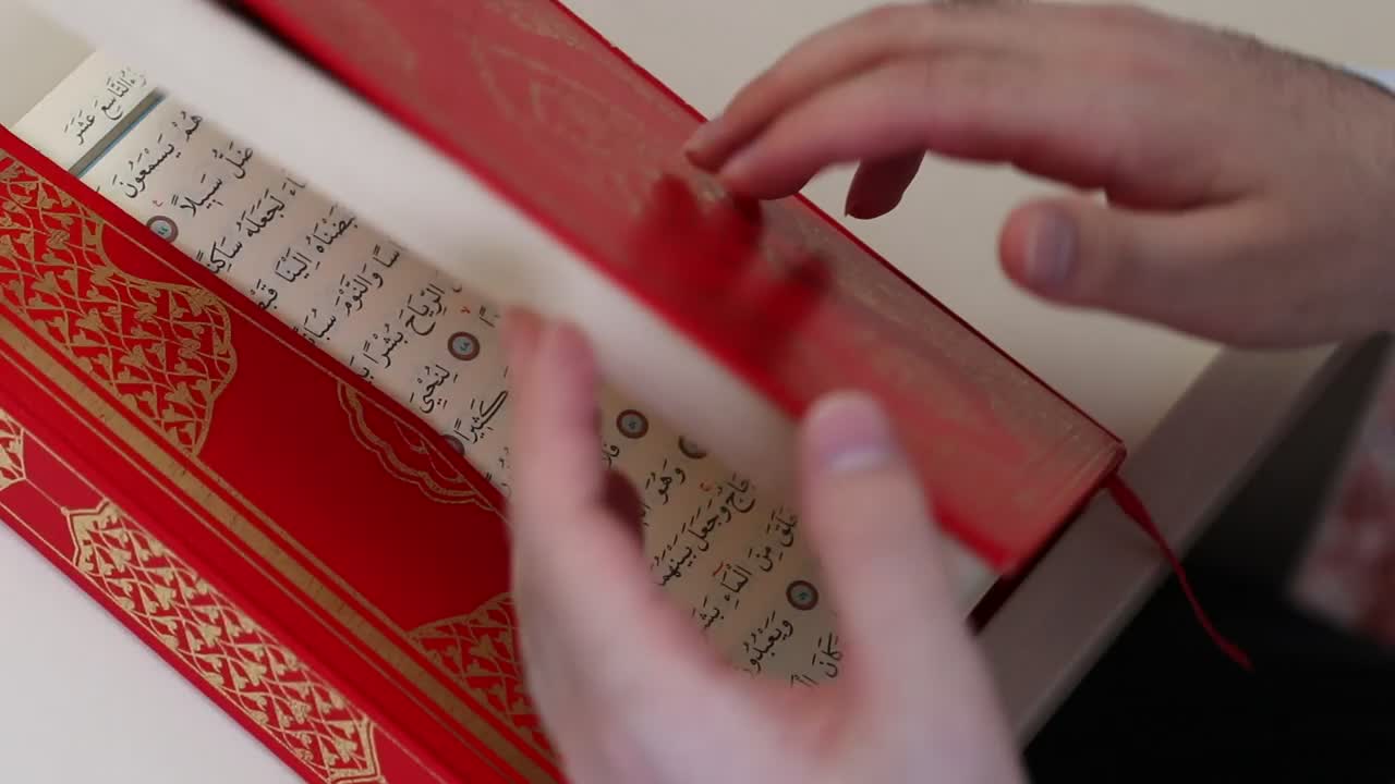 Stock Video Opening A Red Thick Book In Arabic Quran Live Wallpaper