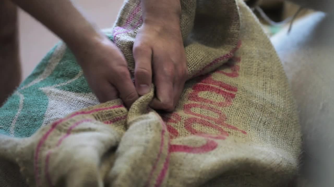 Stock Video Opening A Sack Of Coffee Grain Live Wallpaper