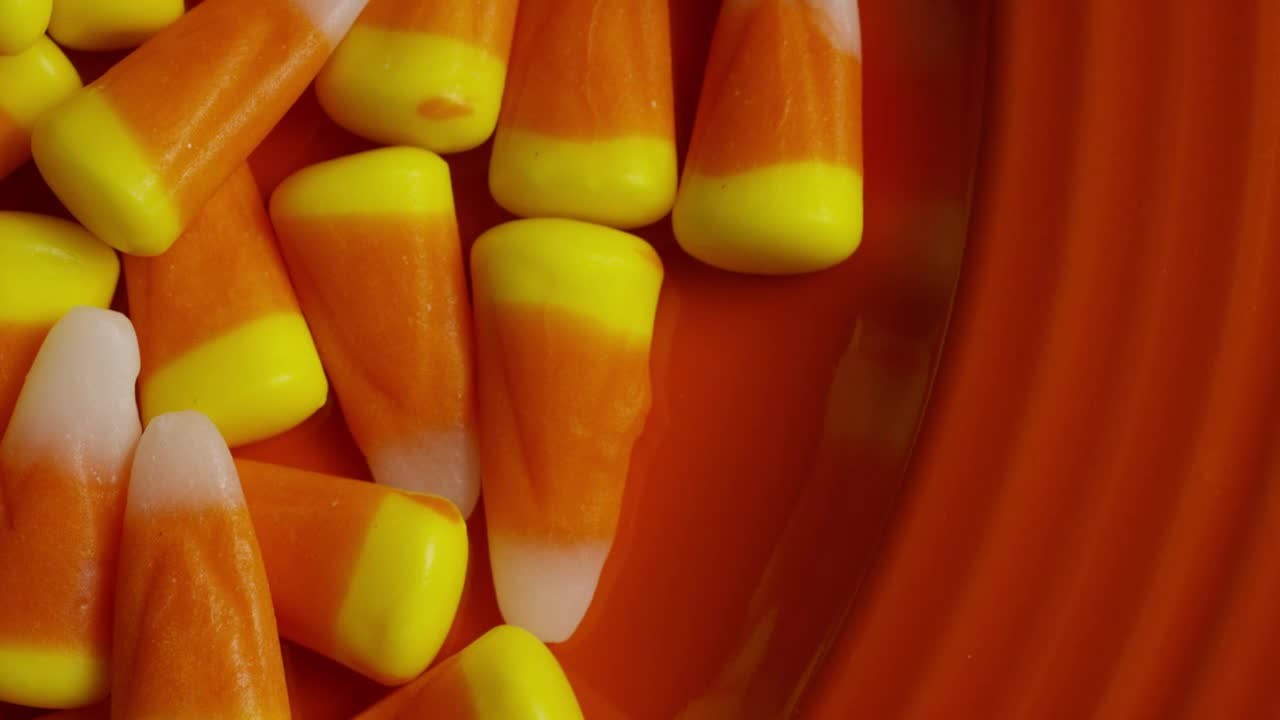 Stock Video Orange Rubbers Rotating On A Plate Of The Same Color Live Wallpaper