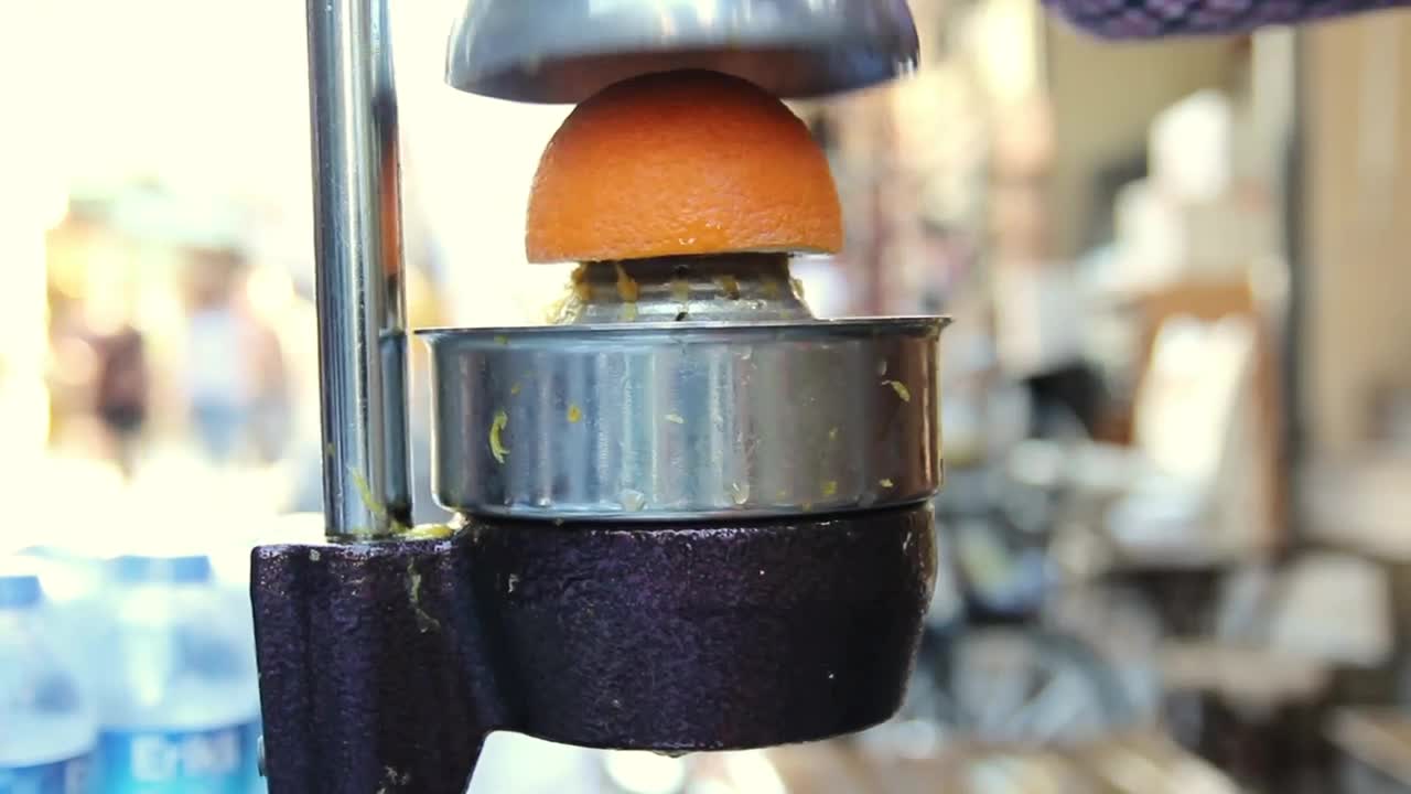 Stock Video Orange Squeezer Used By A Man Live Wallpaper