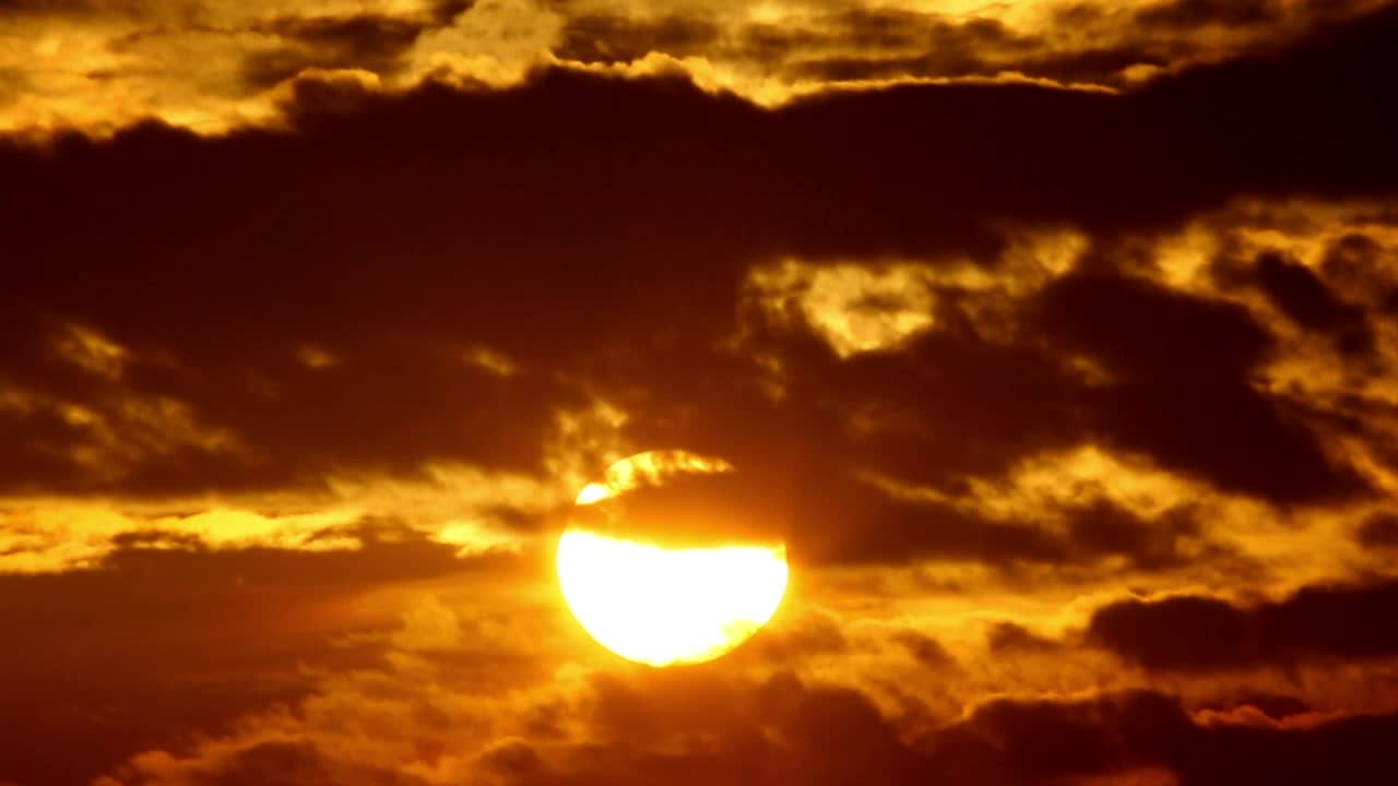 Stock Video Orange Sunrise Against Black Clouds Live Wallpaper