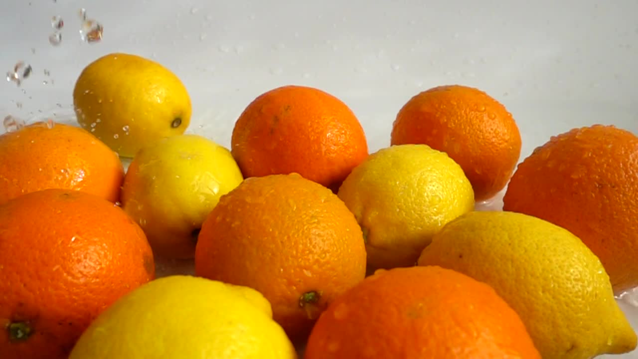 Stock Video Oranges And Lemons Being Wet Live Wallpaper