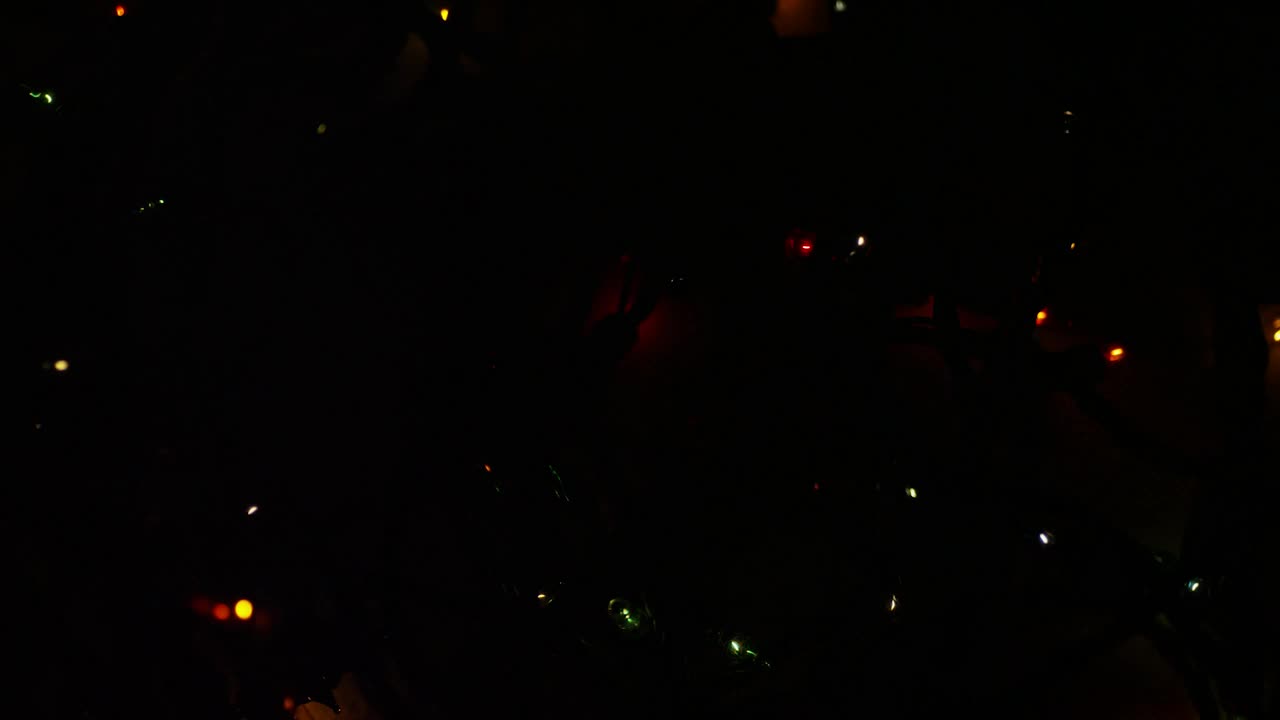 Stock Video Ornamental Christmas Lights In A Dark Room Live Wallpaper