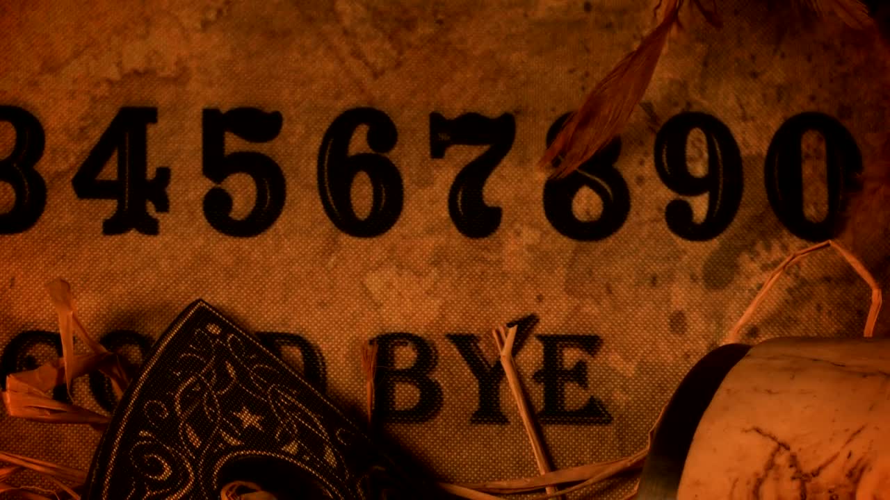 Stock Video Ouija Board Game With A Skull And Candles Live Wallpaper