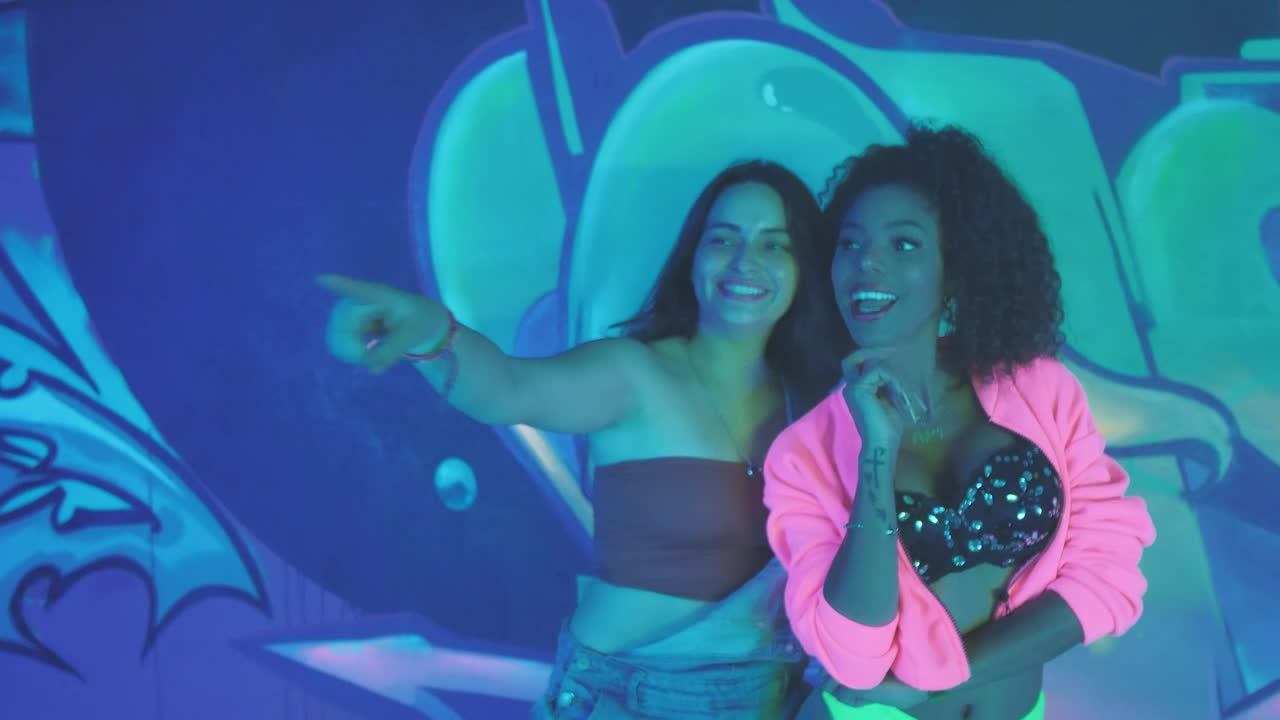 Stock Video Pair Of Girlfriends Laughing Together During A Party Live Wallpaper