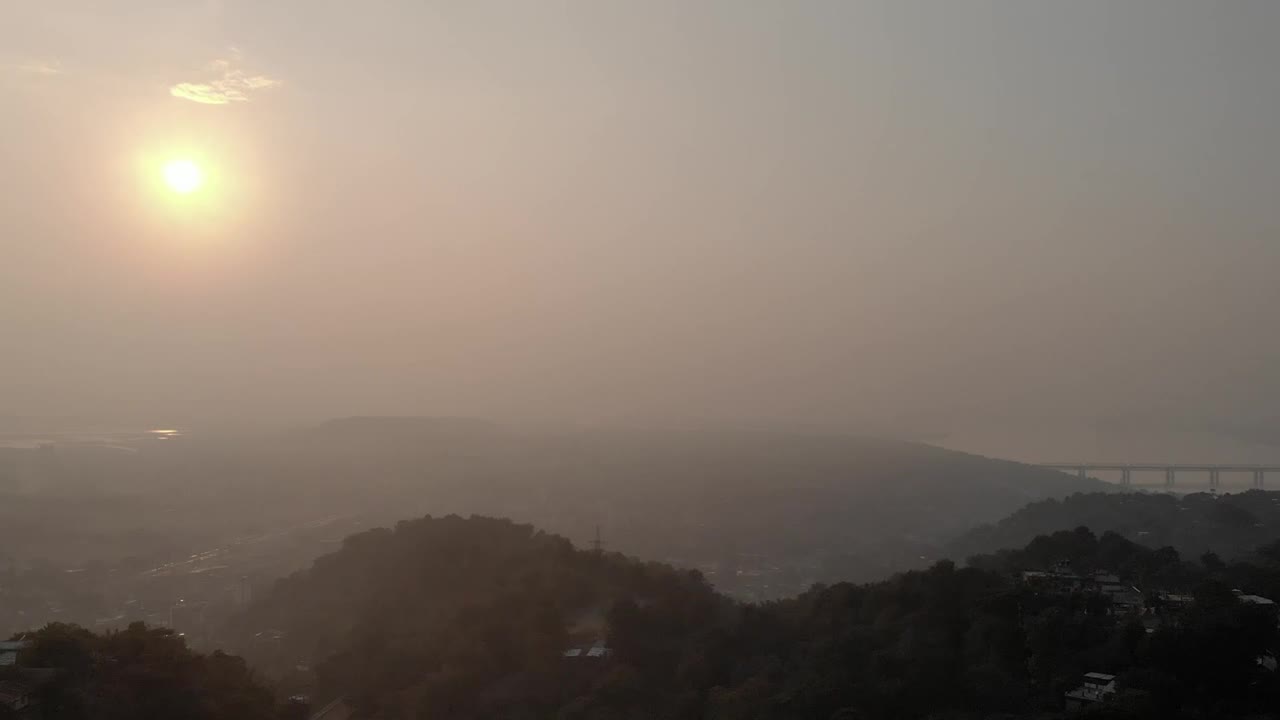 Stock Video Panorama Of A Village Between Hills Full Of Mist Live Wallpaper
