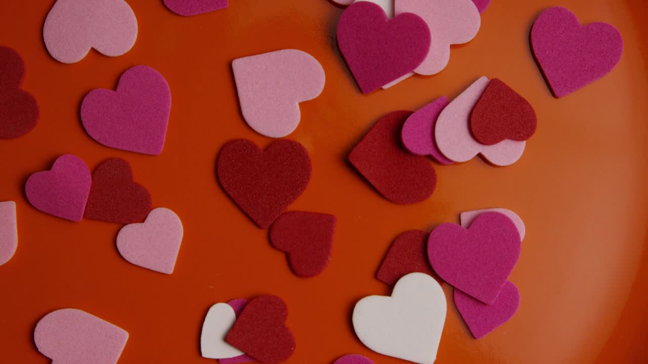Stock Video Paper Shape Hearts On An Orange Surface Live Wallpaper