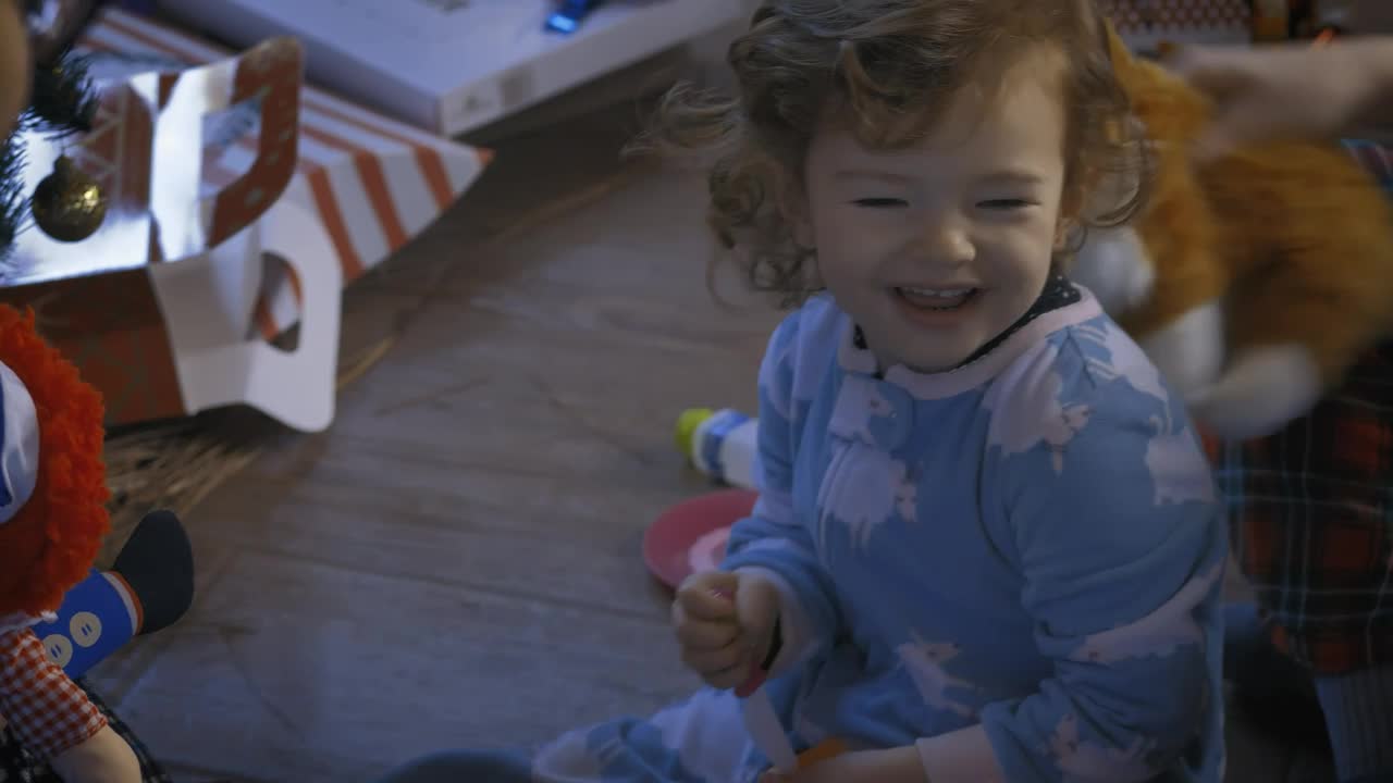 Stock Video Parents Playing With Their Little Daughter At Christmas Live Wallpaper