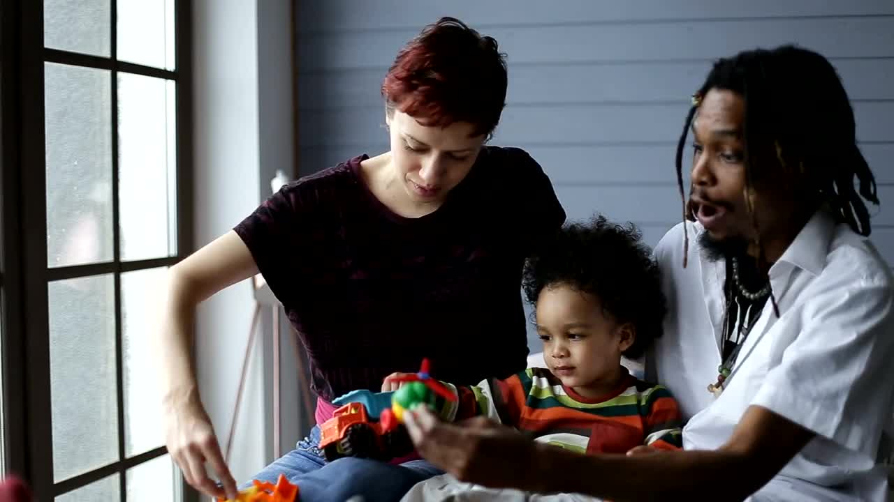 Stock Video Parents Playing With Their Young Child Live Wallpaper