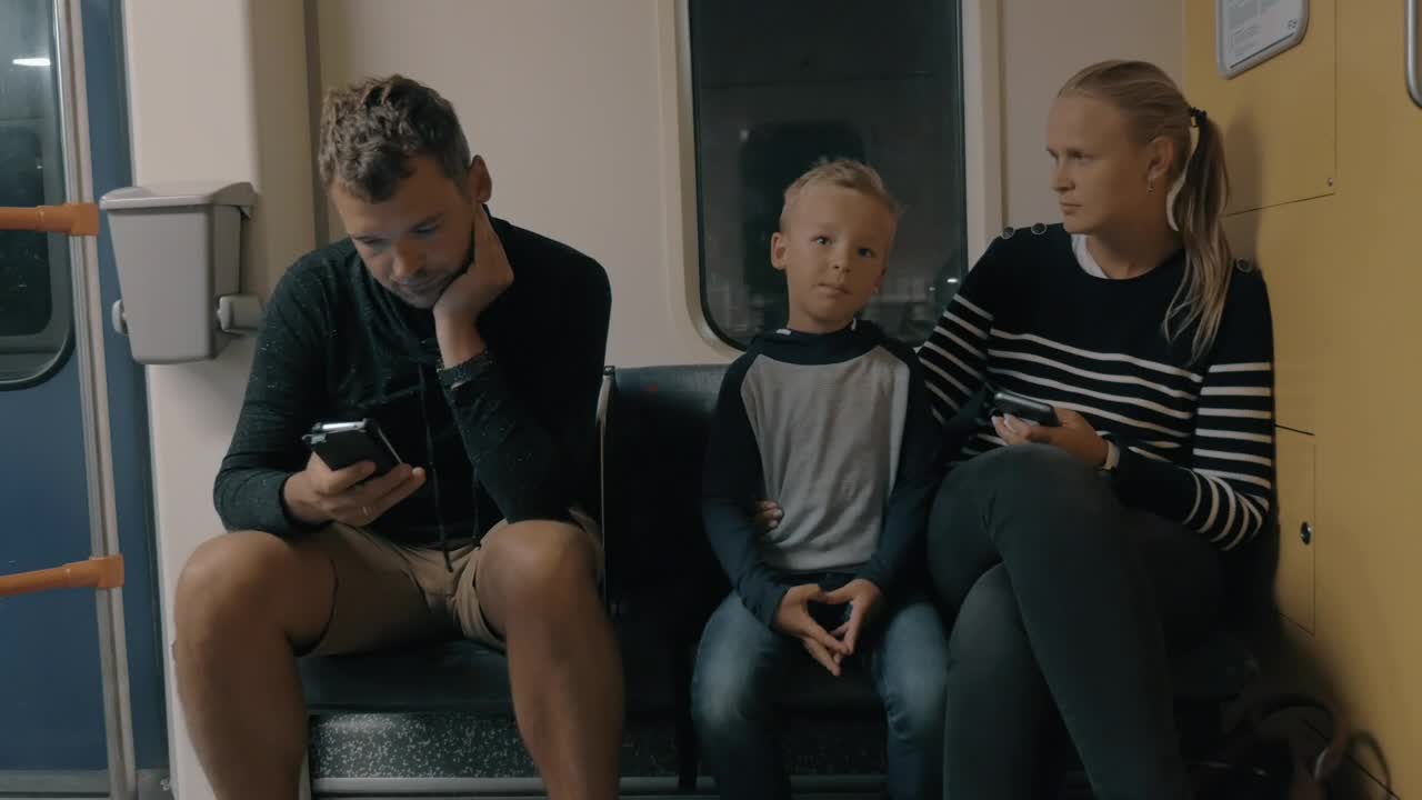 Stock Video Parents With Their Child On The Train Live Wallpaper