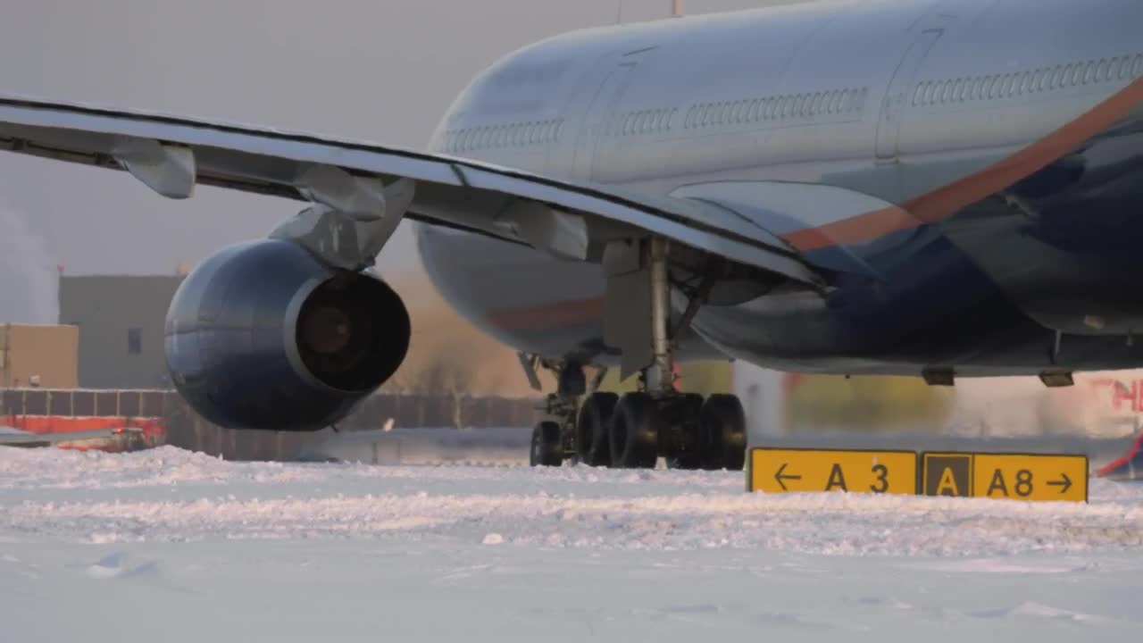 Stock Video Passenger Plane On A Snowy Runway Live Wallpaper