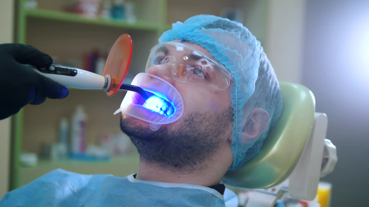 Stock Video Patient During A Dental Whitening Session Live Wallpaper