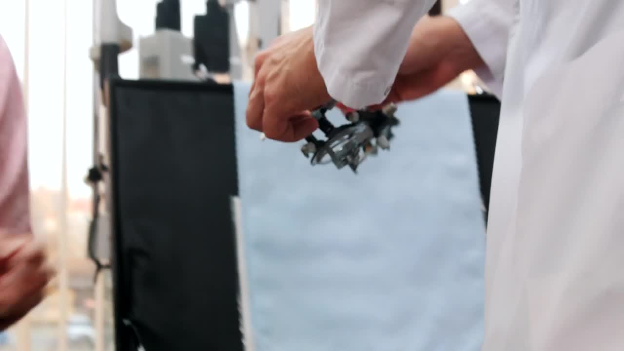 Stock Video Patient Woman Using Vision Test Device Live Wallpaper