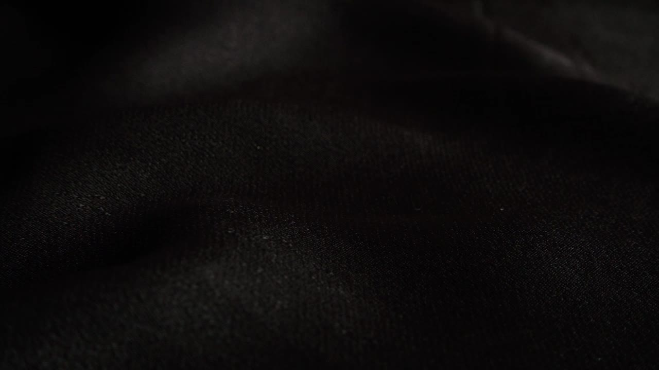 Stock Video Pearls Falling On A Black Cloth Live Wallpaper
