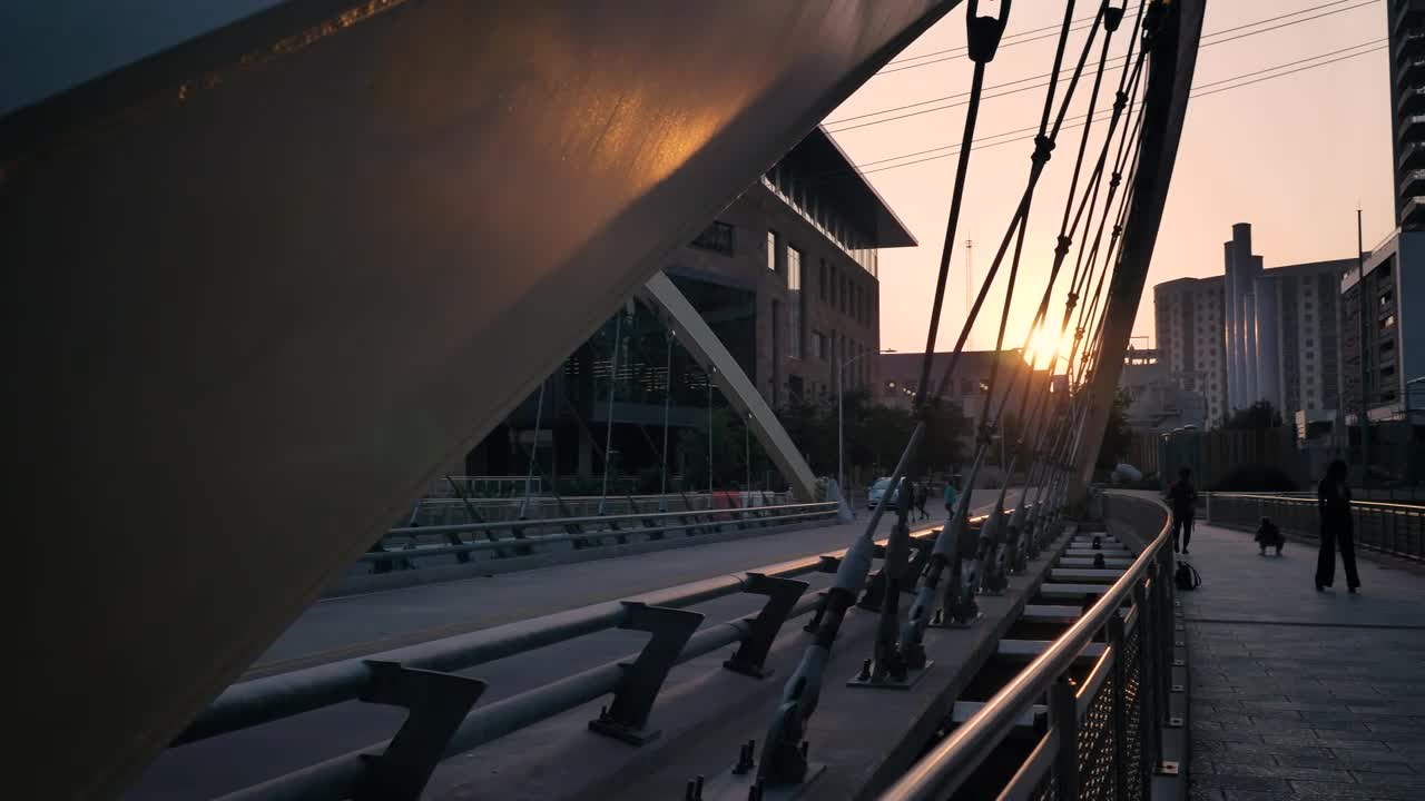 Stock Video Pedestrian Bridge In A City At Sunset Live Wallpaper