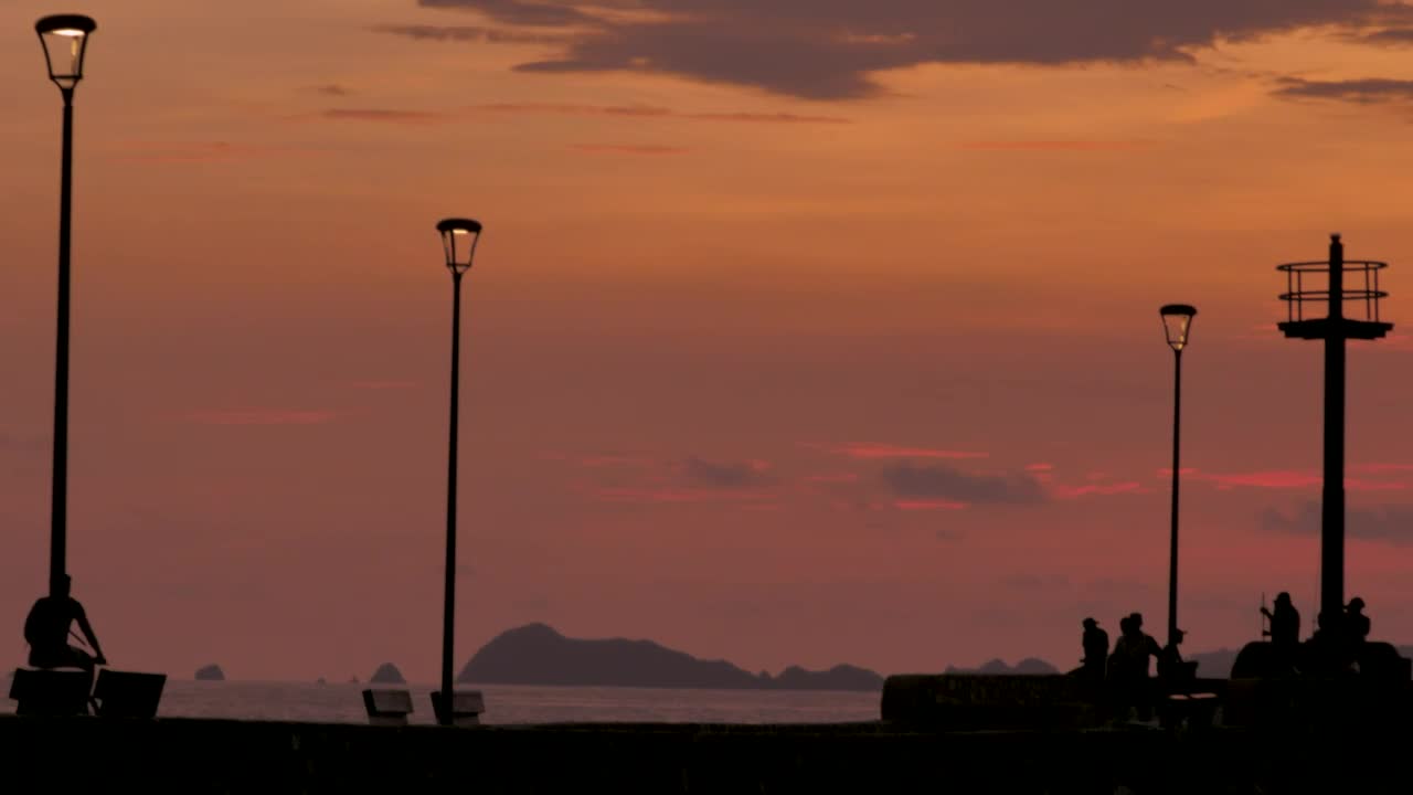 Stock Video Pedestrians On A Beach Pier In The Sunset Live Wallpaper