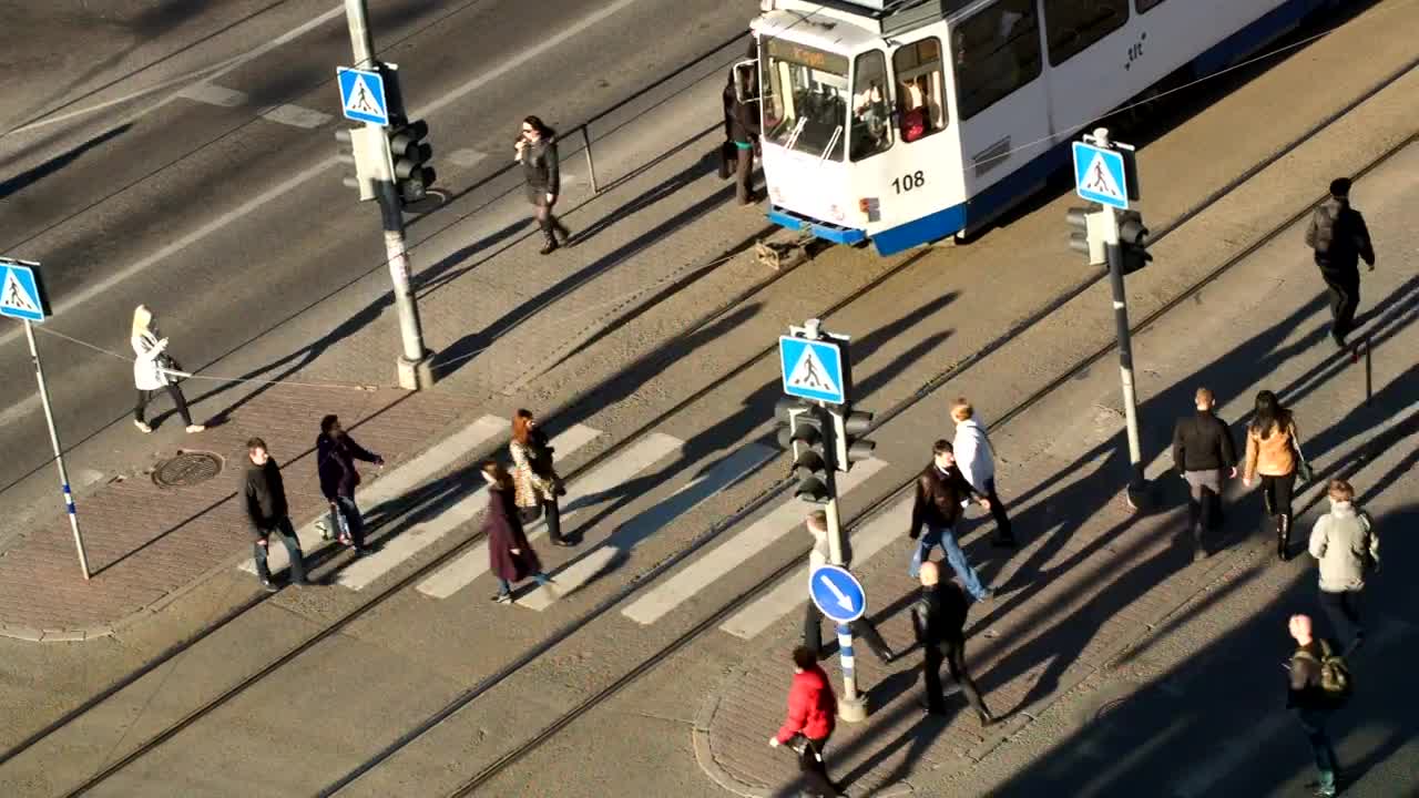 Stock Video Pedestrians Walking By A Tram Live Wallpaper