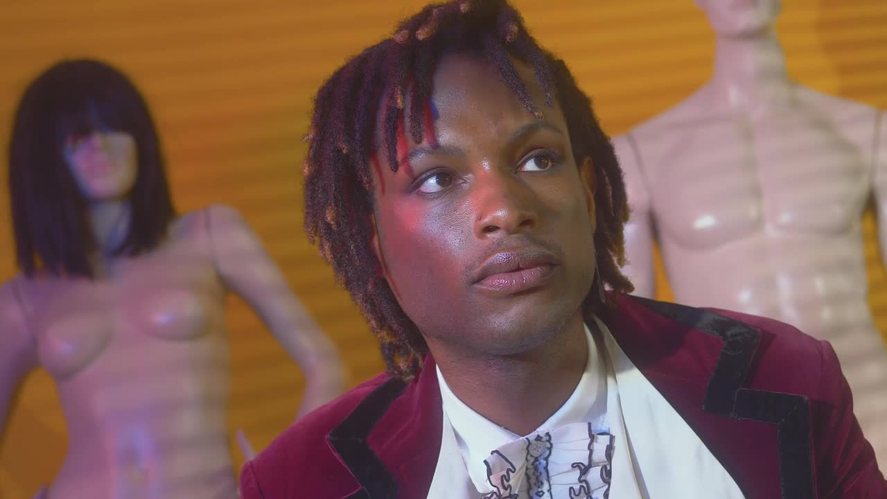 Stock Video Pensive Fashion Designer Surrounded By Mannequins Live Wallpaper