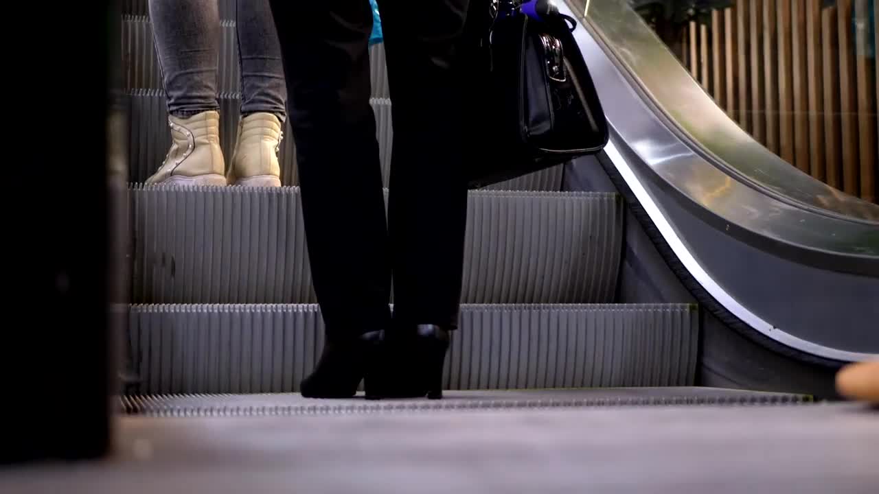 Stock Video People Boarding The Escalator Live Wallpaper