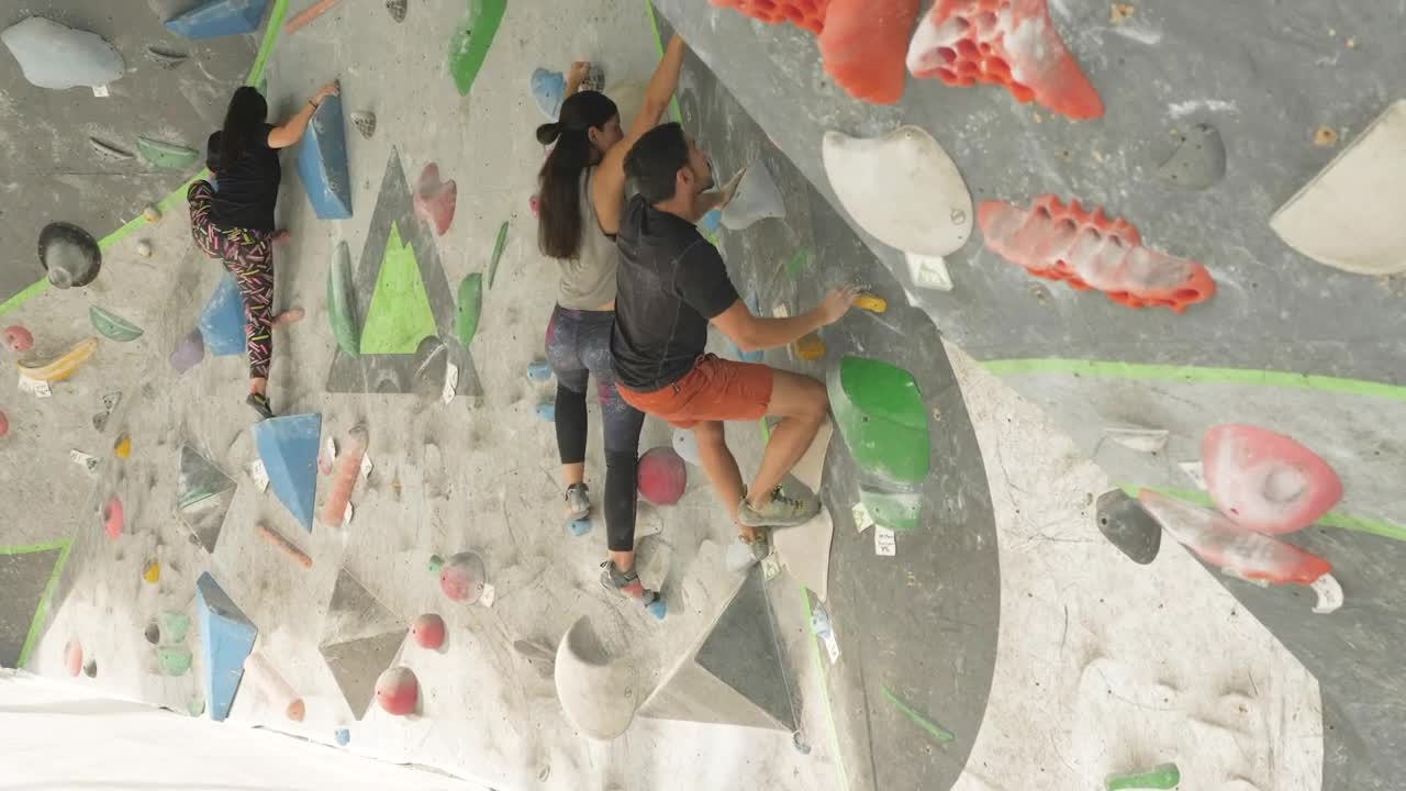 Stock Video People Climbing On A Mountaineering Wall Live Wallpaper