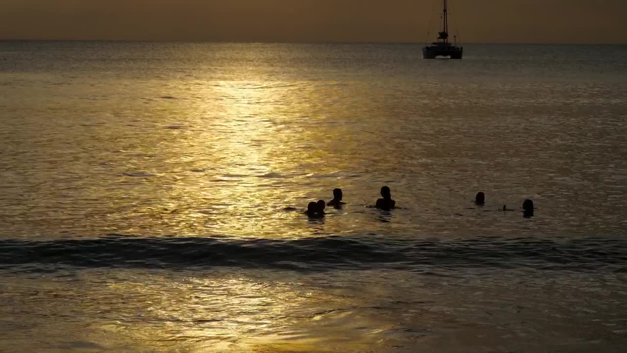 Stock Video People Enjoying The Ocean At Sunset Live Wallpaper