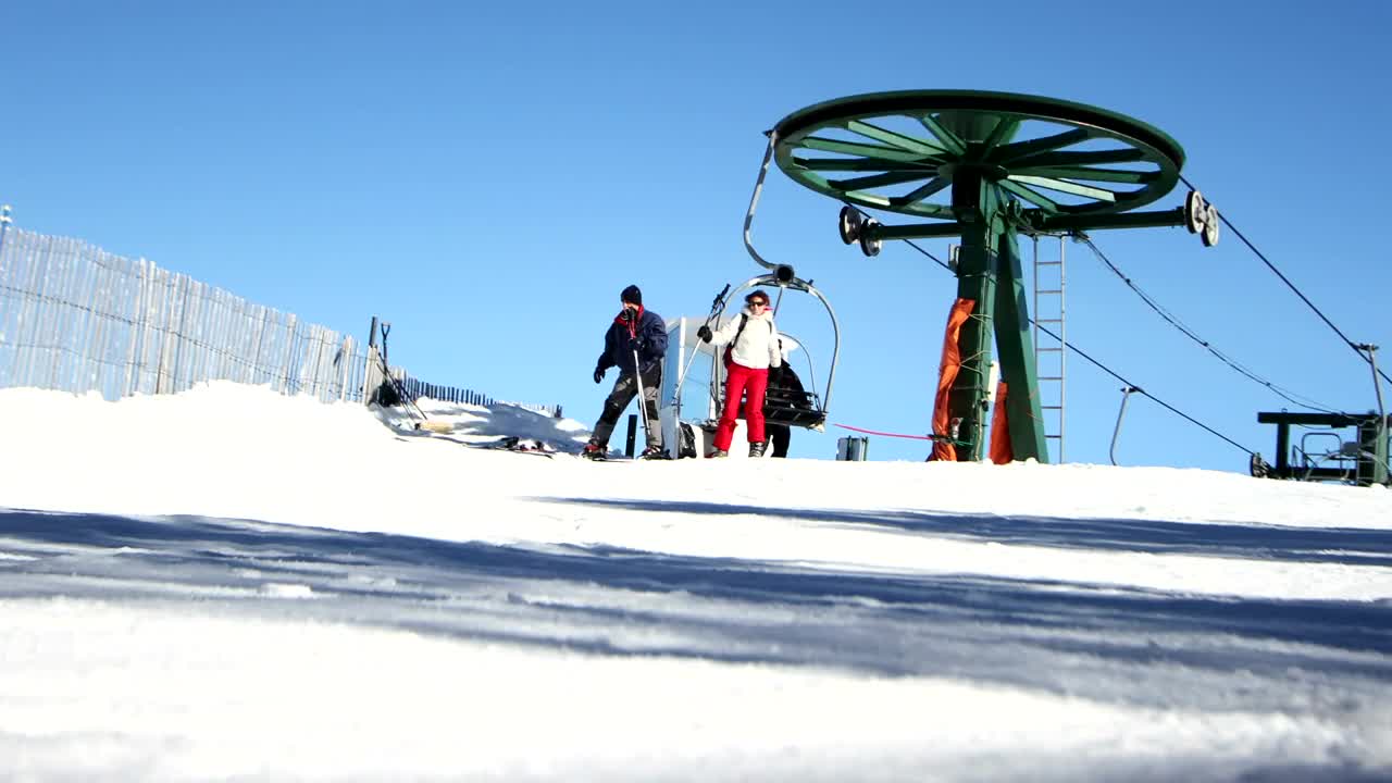 Stock Video People Getting Off The Ski Lift Live Wallpaper