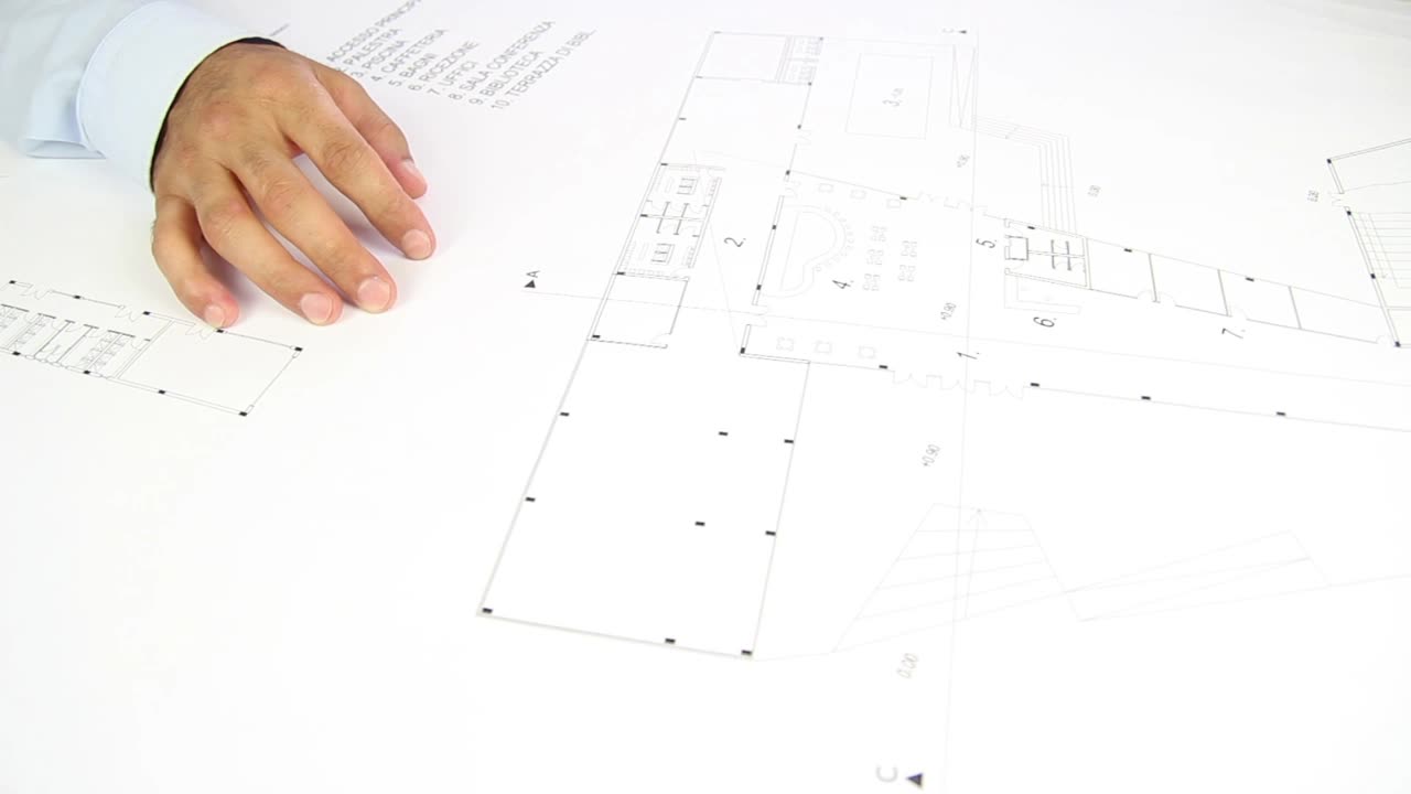 Stock Video People Hands Unrolling A Blueprint On A Table Live Wallpaper