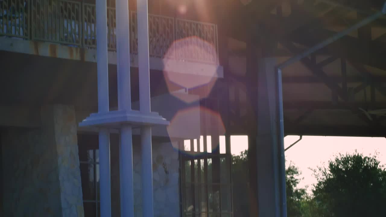 Stock Video People Hanging Out In A Building Surrounded By A Park Live Wallpaper