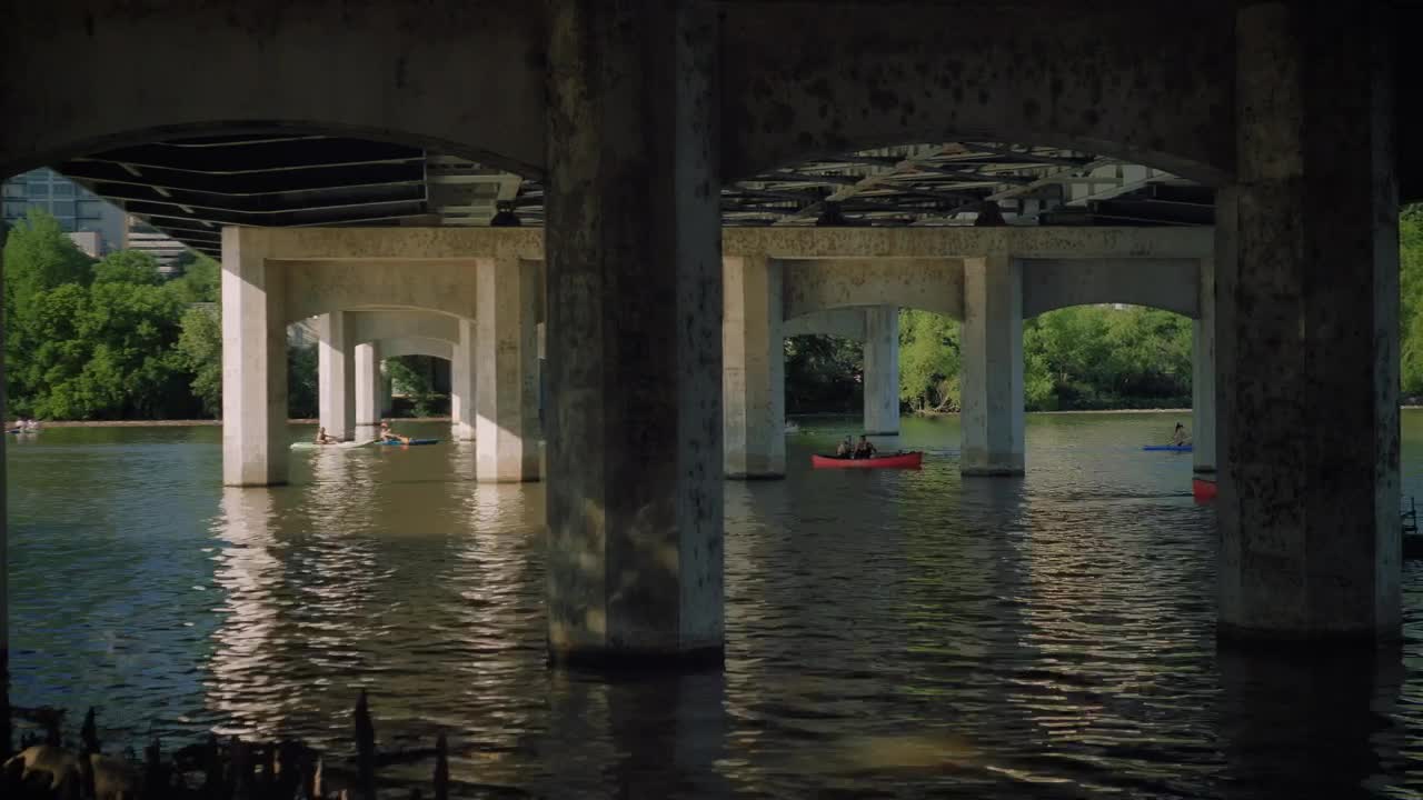 Stock Video People Sailing In A Motorboat Under A Bridge Live Wallpaper