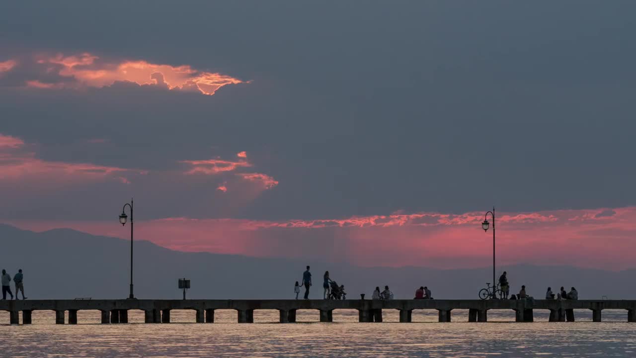 Stock Video People Walking Along A Pier At Night Live Wallpaper