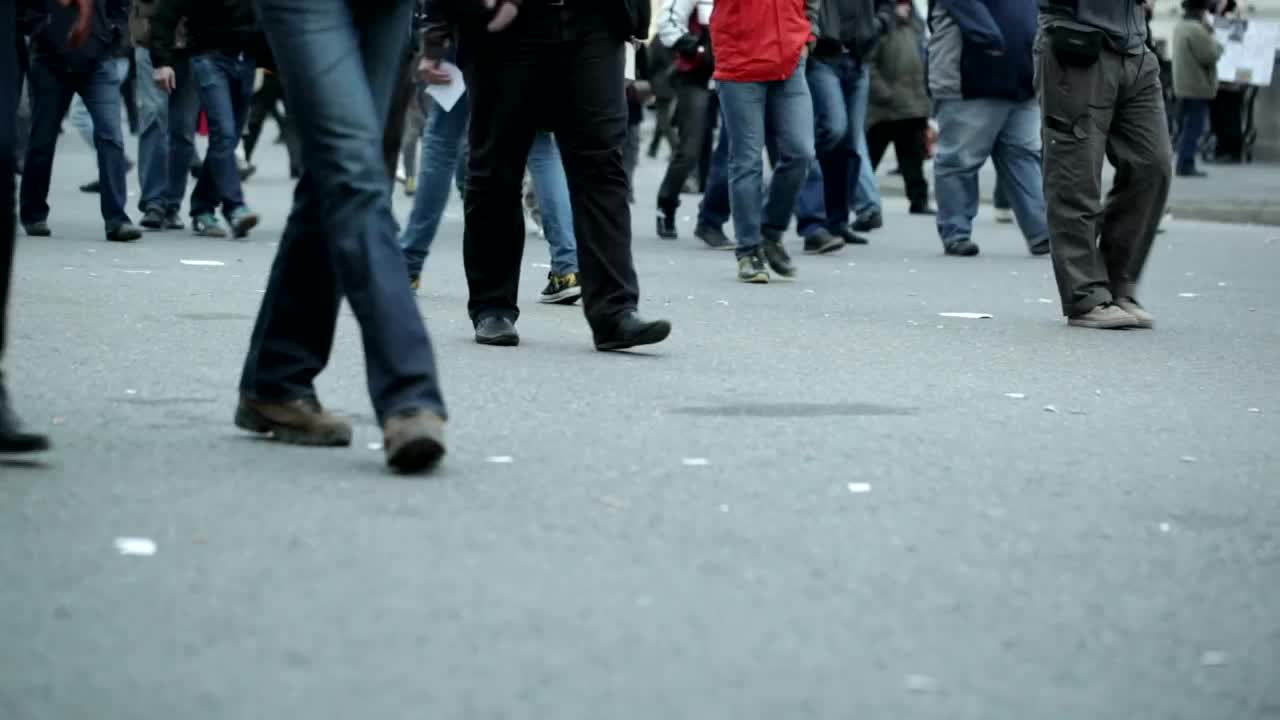 Stock Video People Walking Slowly Across Town Live Wallpaper