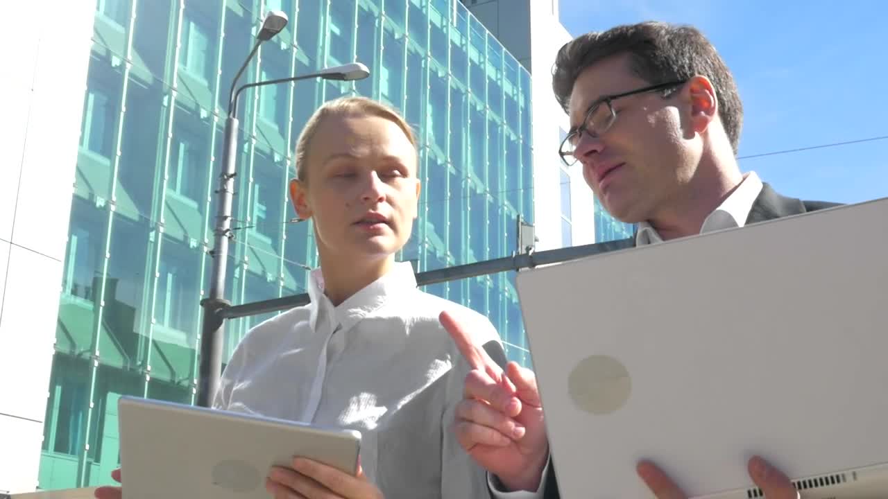 Stock Video People Walking With A Laptop And Tablet Live Wallpaper