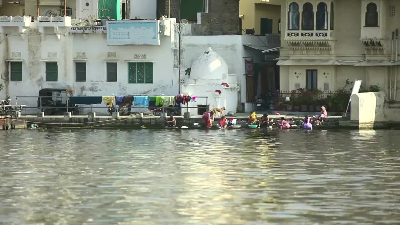 Stock Video People Washing Clothes In The River Live Wallpaper