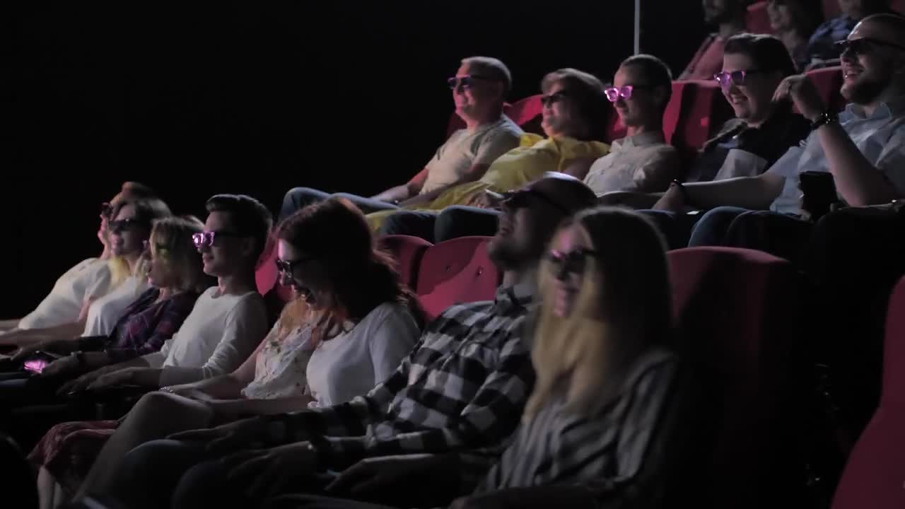Stock Video People Watching A D Film Live Wallpaper