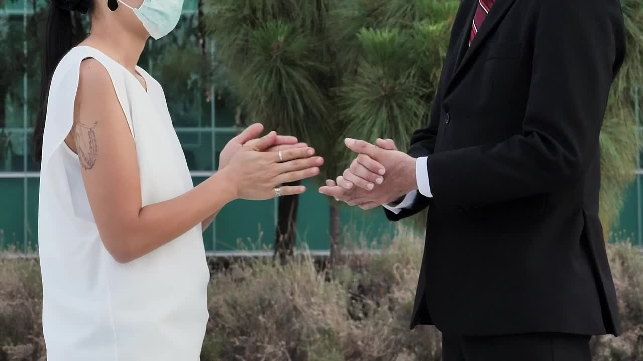 Stock Video People With Masks Applying Antibacterial Gel On Their Hands Live Wallpaper