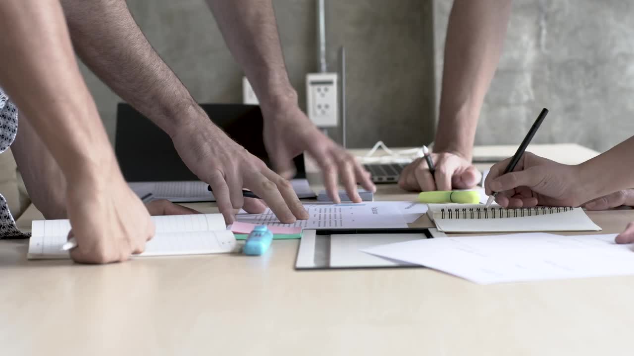 Stock Video Peoples Hands On A Table In A Business Meeting Live Wallpaper