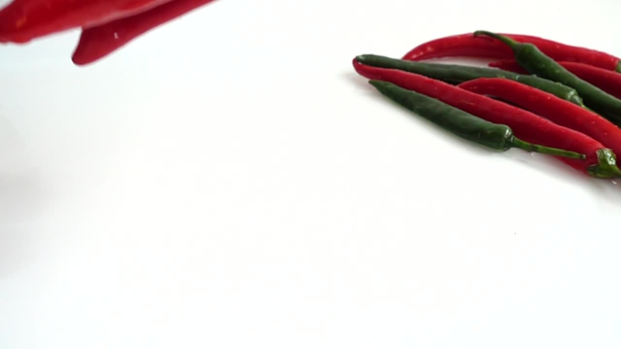 Stock Video Peppers Falling Into Water And Splashing Live Wallpaper