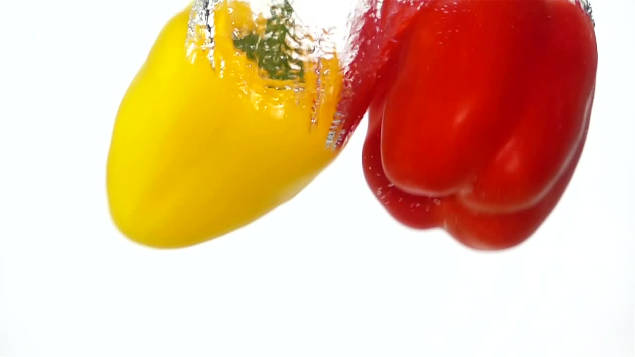 Stock Video Peppers Falling Through Water Live Wallpaper