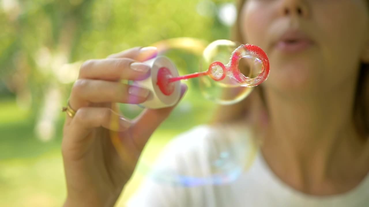 Stock Video Person Blowing Soap Bubbles In The Outside Live Wallpaper