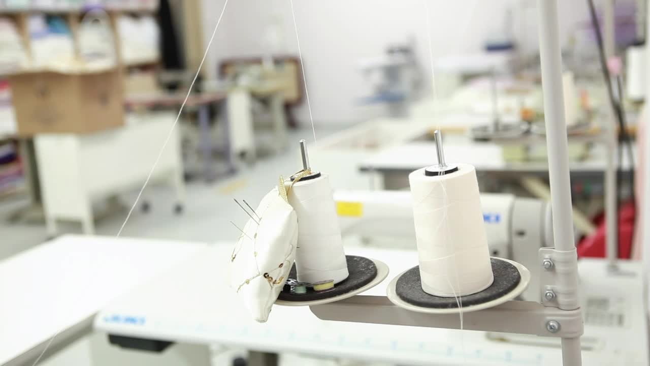 Stock Video Person Changing The Thread Of A Sewing Machine Live Wallpaper