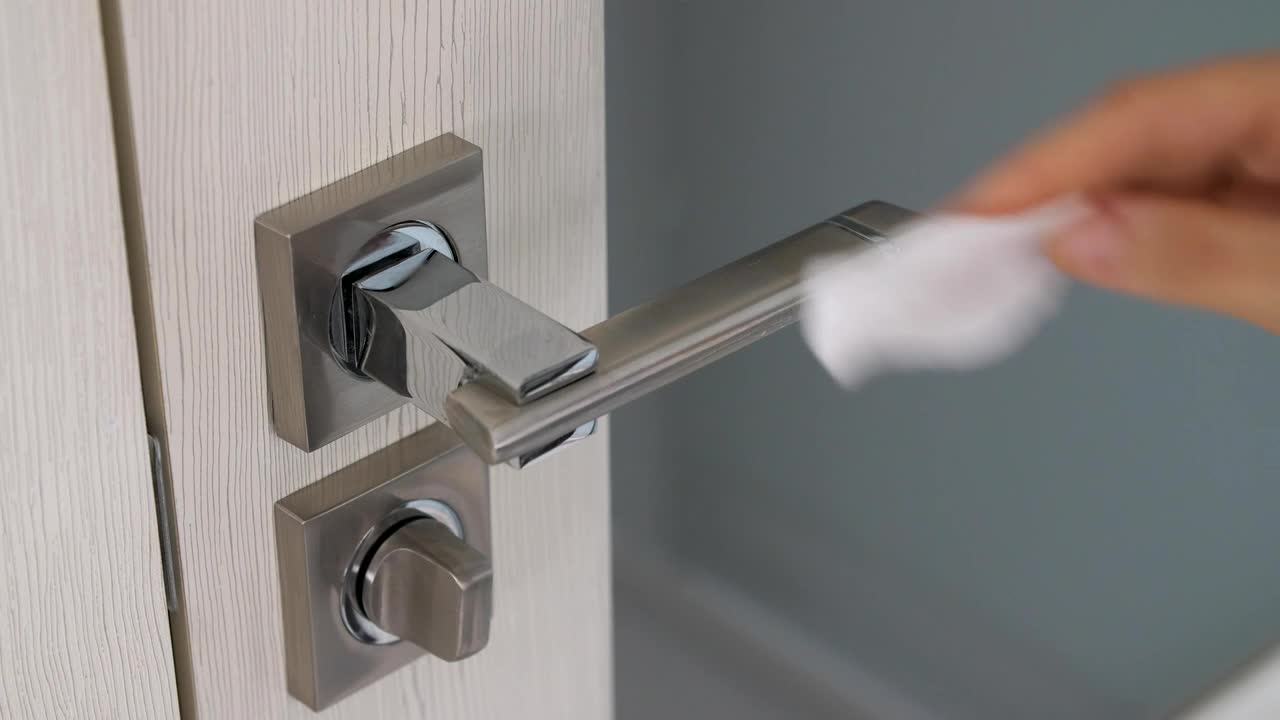 Stock Video Person Cleaning A Door Handle Live Wallpaper