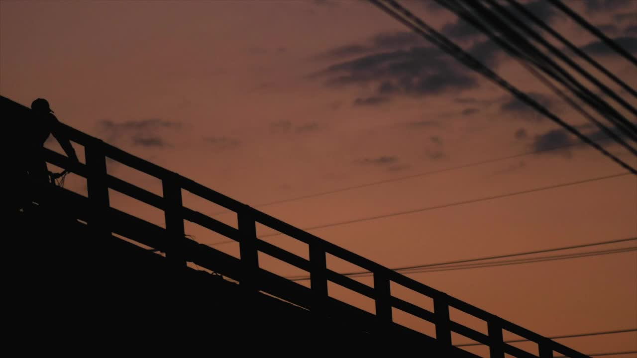 Stock Video Person Cycling On Bridge Live Wallpaper