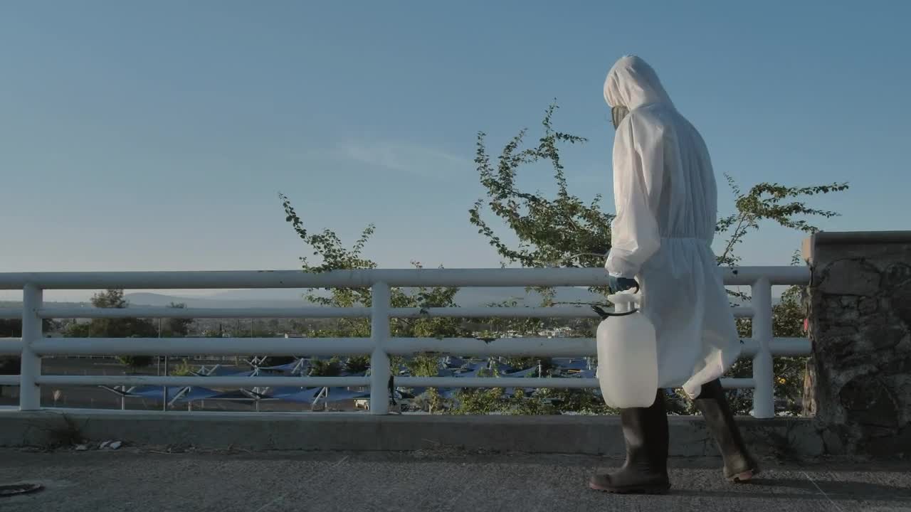 Stock Video Person Disinfecting A Bridge Live Wallpaper