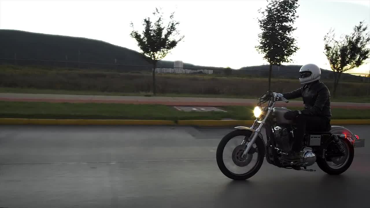 Stock Video Person Driving A Motorcycle In The Street Live Wallpaper